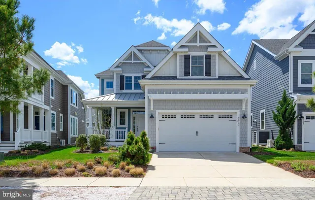 an aerial view of residential houses with outdoor space and swimming pool
