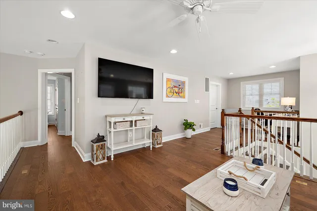 a spacious bedroom with a bed and a chandelier