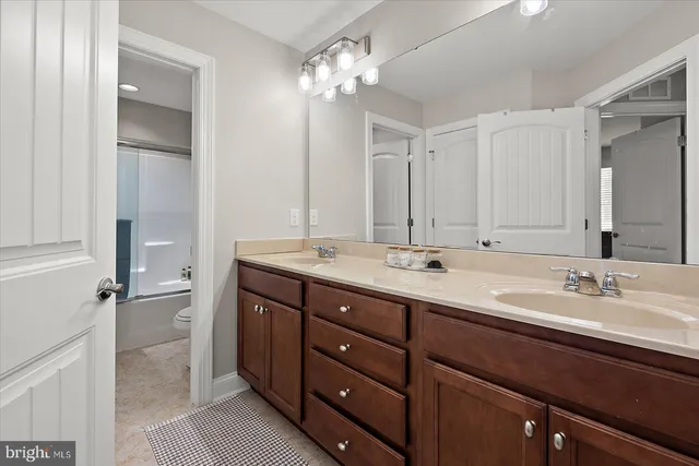 a view of a wooden chairs and table on the deck