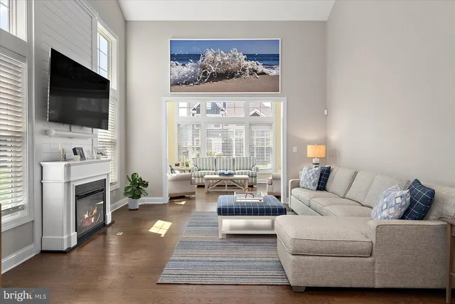 a living room with furniture fireplace and a flat screen tv