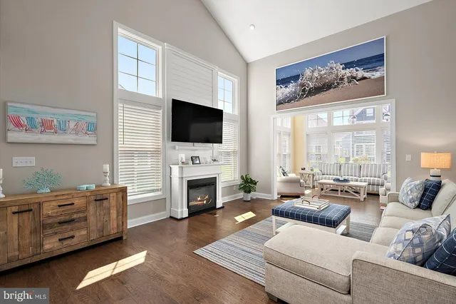 a large kitchen with kitchen island granite countertop lots of white cabinets appliances and furniture