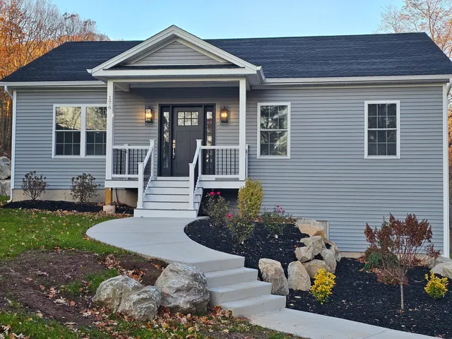 a front view of a house with a yard