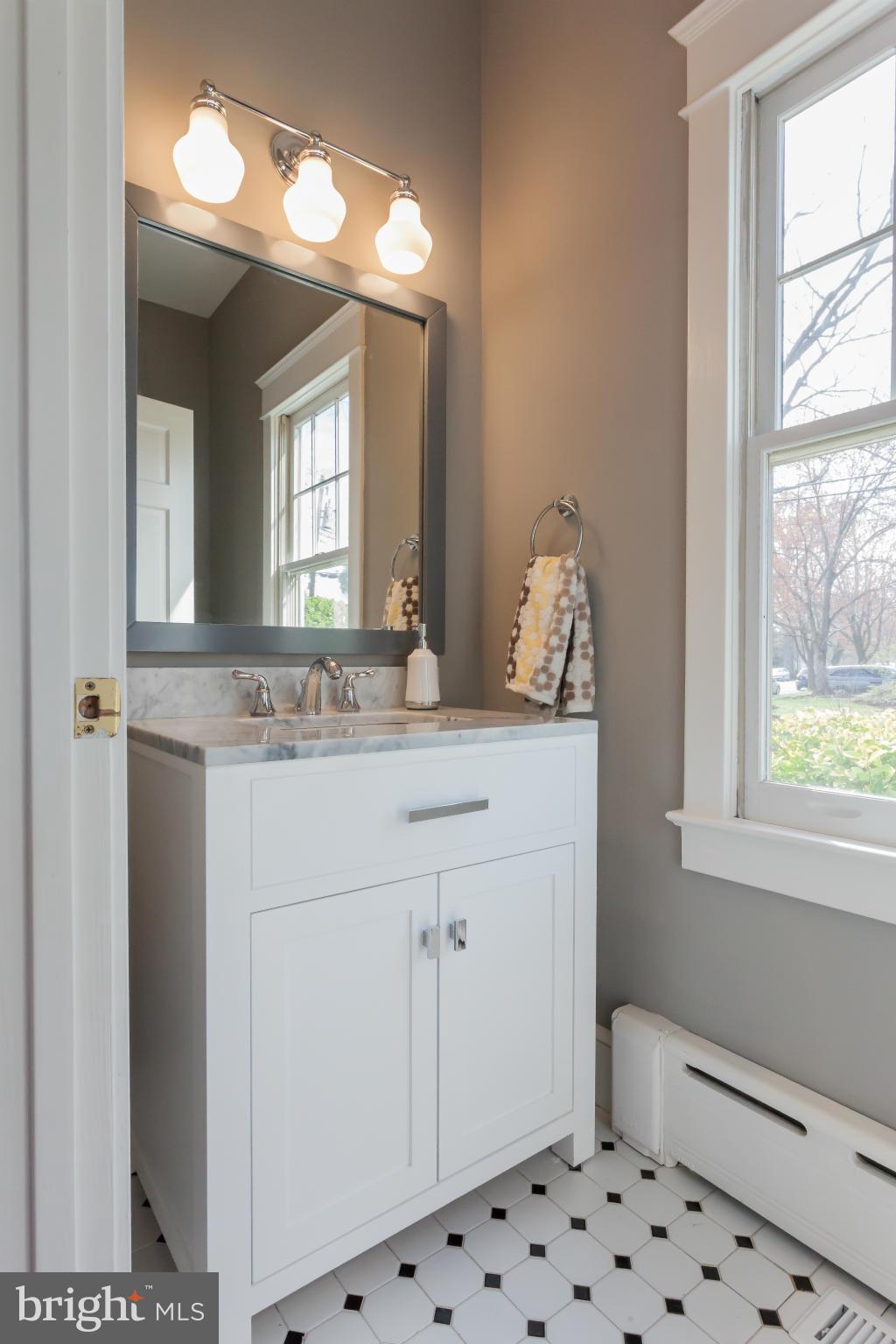 2531 Key Boulevard Arlington, VA 22201 - Photo 12 of 19 a bathroom with a sink and a mirror