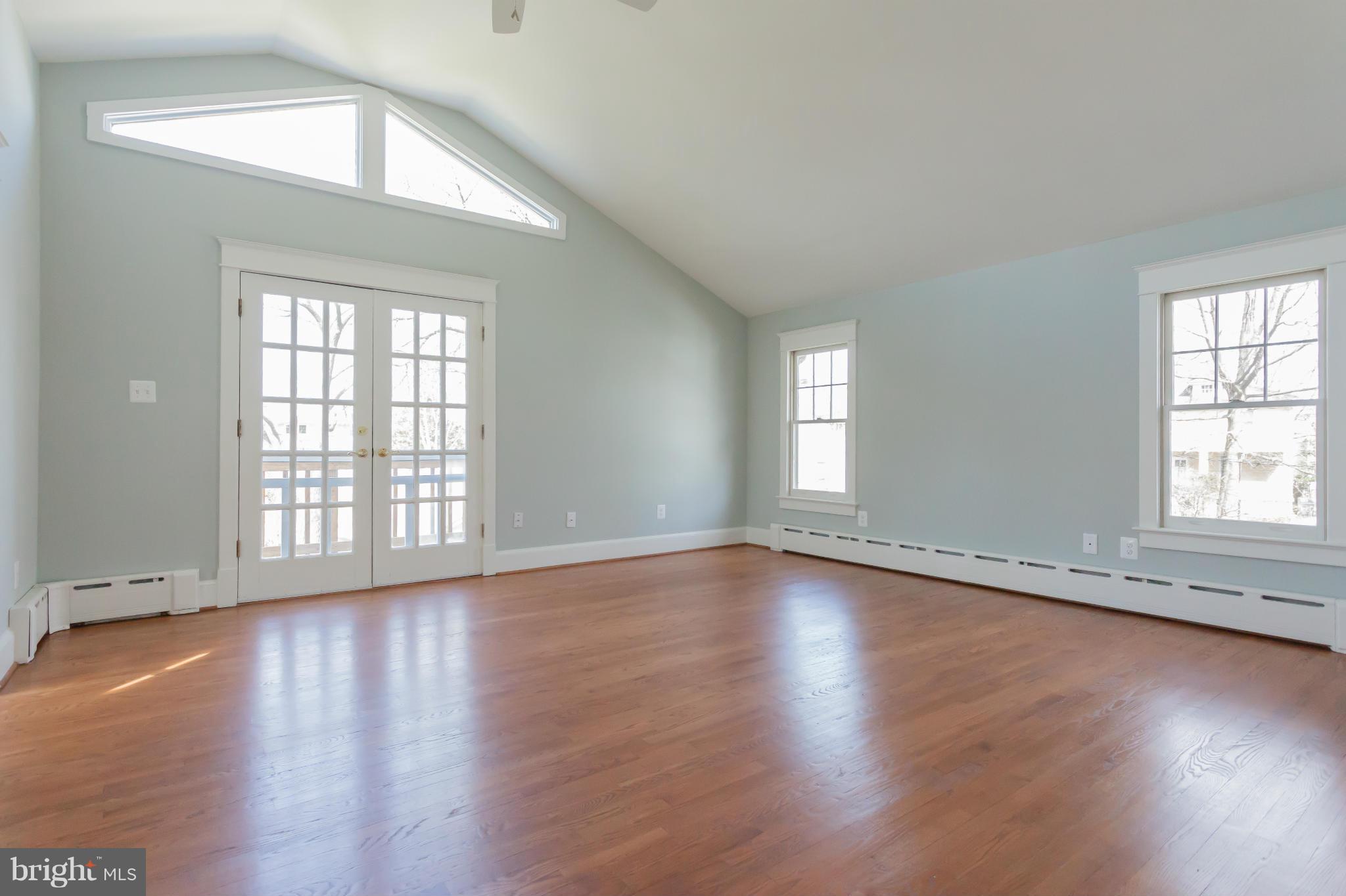 2531 Key Boulevard Arlington, VA 22201 - Photo 13 of 19 an empty room with wooden floor and windows