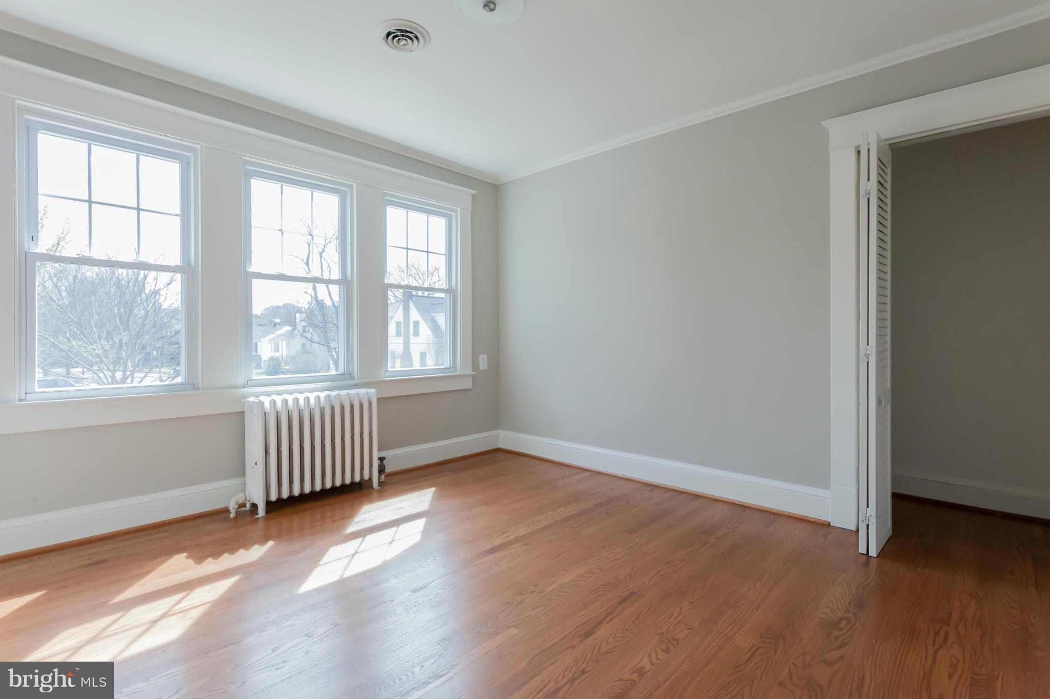 2531 Key Boulevard Arlington, VA 22201 - Photo 19 of 19 an empty room with wooden floor and windows