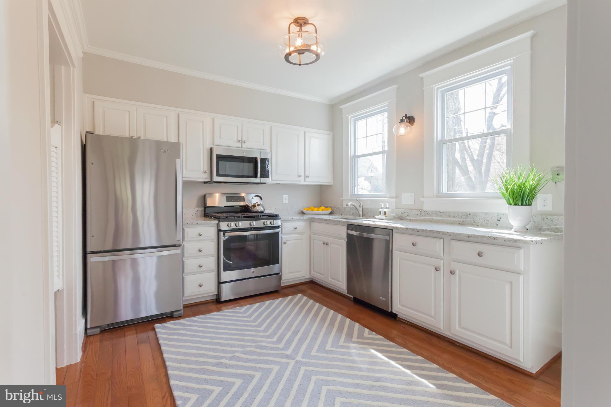 2531 Key Boulevard Arlington, VA 22201 - Photo 9 of 19 a kitchen with a refrigerator stove and microwave