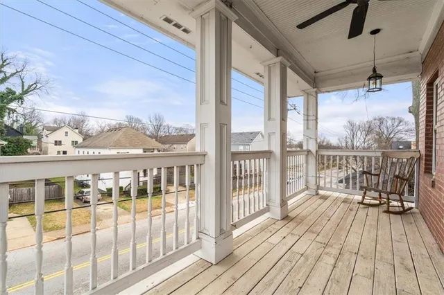 a view of a balcony with wooden floor