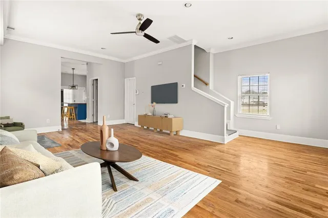 a living room with couch and a flat screen tv