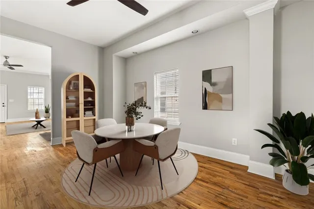a view of a dining room with furniture window and wooden floor