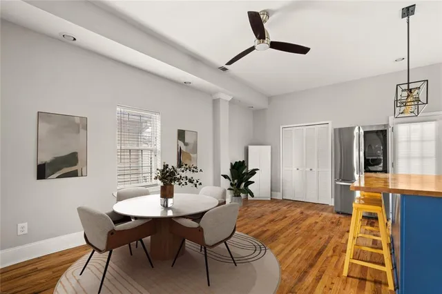 a dining room with furniture and window