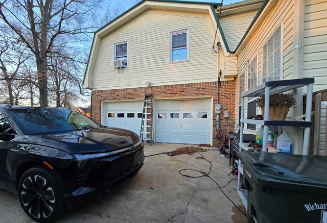 a front view of a house with parking space