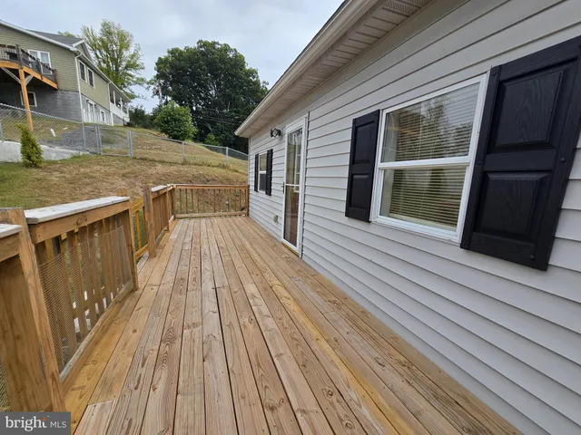 a view of outdoor space with wooden floor