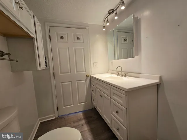 a bathroom with a double vanity sink and mirror
