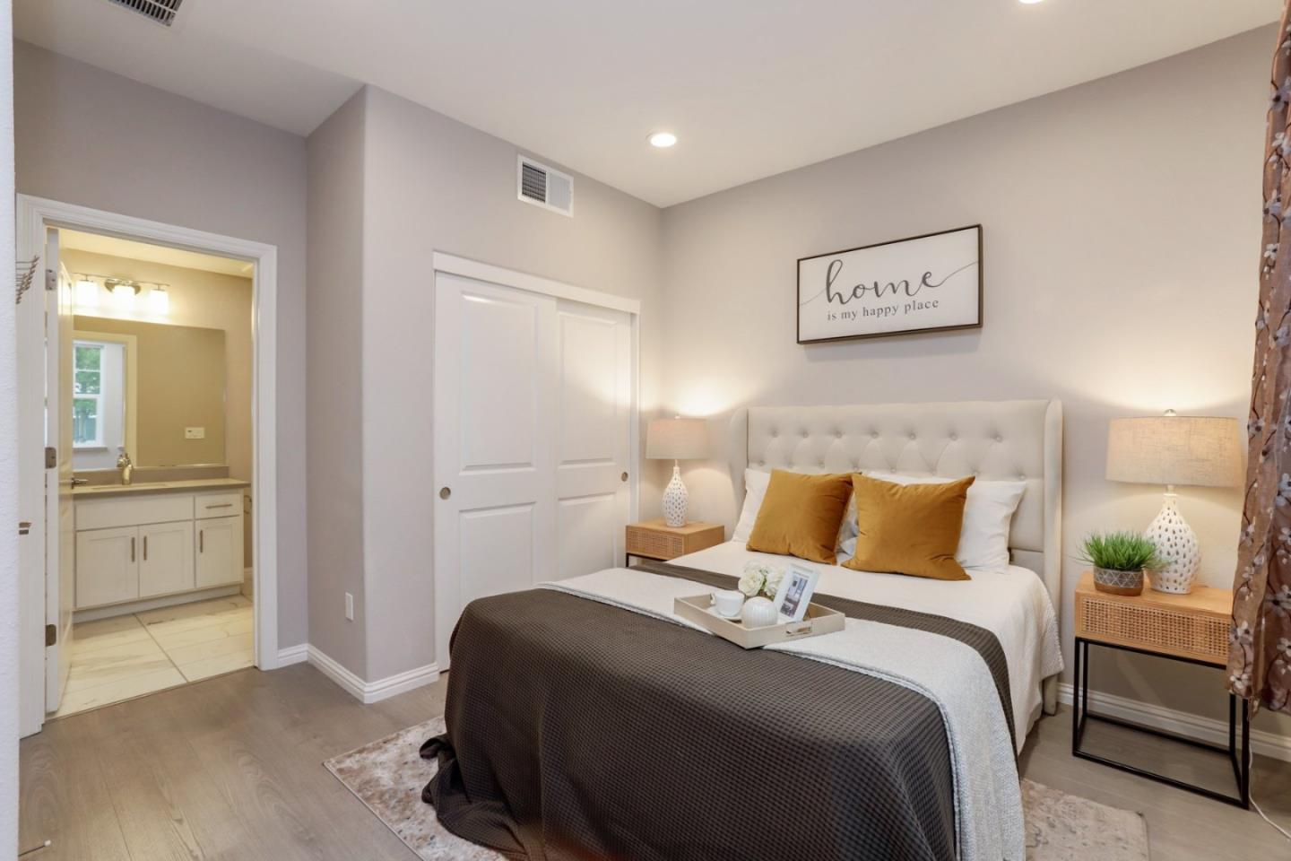 141 Orbit Way Mountain View, CA 94043 - Photo 12 of 14 a bedroom with a bed and a painting on the wall