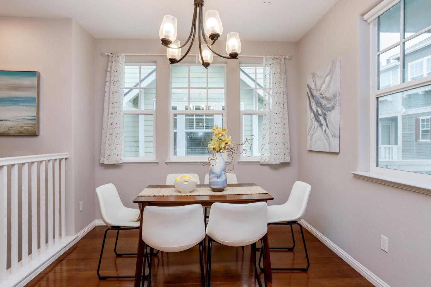 141 Orbit Way Mountain View, CA 94043 - Photo 7 of 14 a dining room with furniture a chandelier and wooden floor
