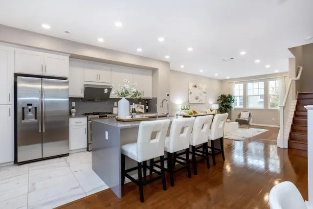 a large kitchen with a table and chairs