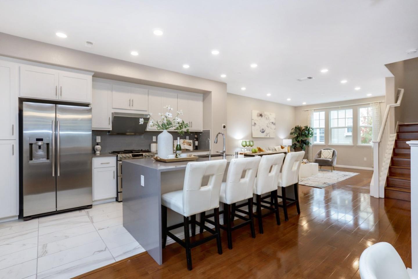 141 Orbit Way Mountain View, CA 94043 - Photo 10 of 14 a large kitchen with a table and chairs