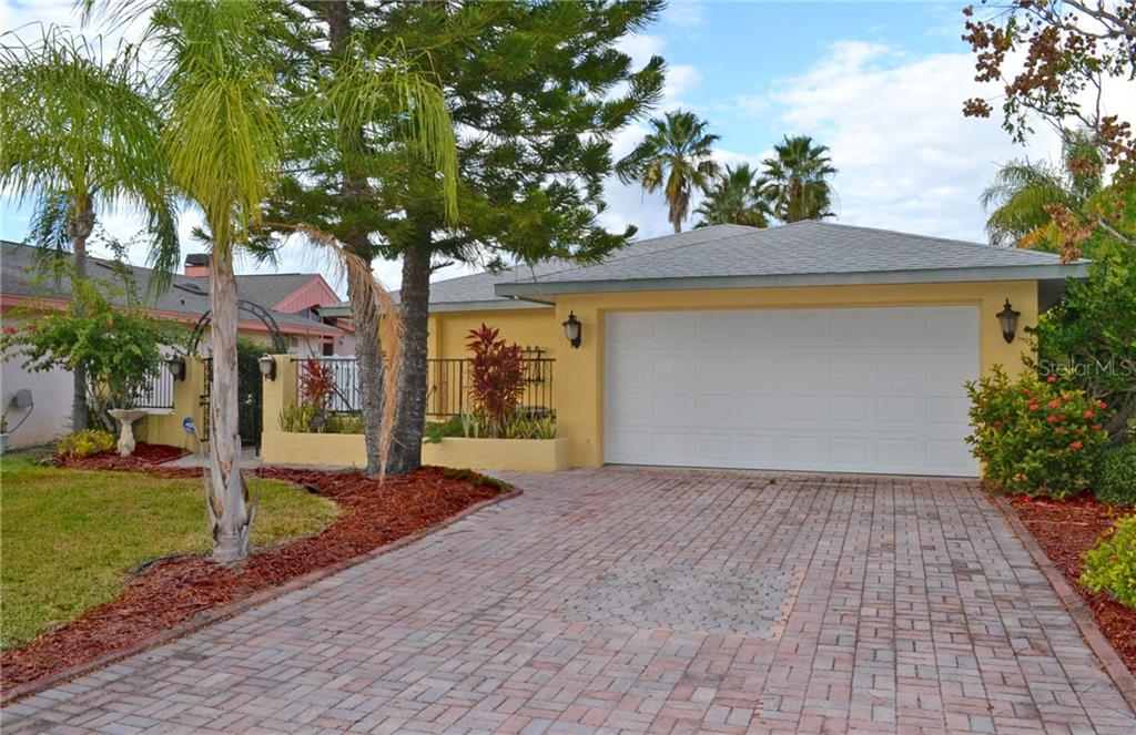 4529 Rickover Court New Port Richey, FL 34652 - Photo 1 of 1 a front view of a house with a yard and garage