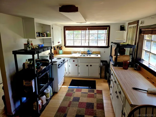 a living room with furniture and a ceiling fan