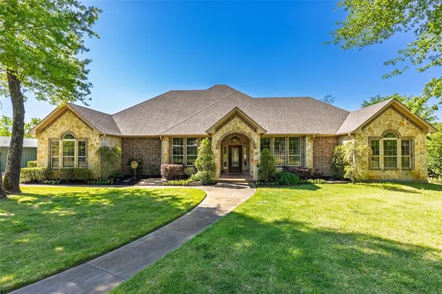 a view of house with outdoor space and swimming pool