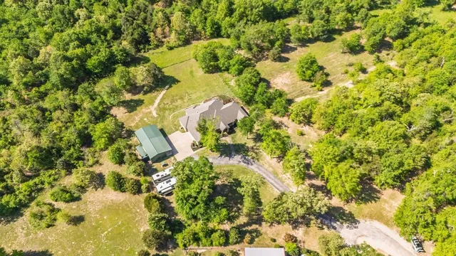 a view of a swimming pool with sitting area