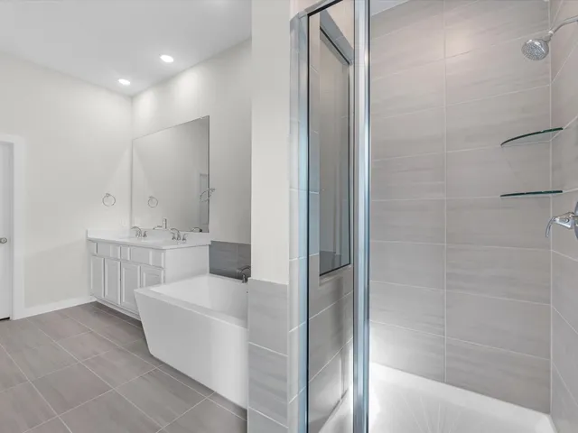 a bathroom with a bathtub and a sink