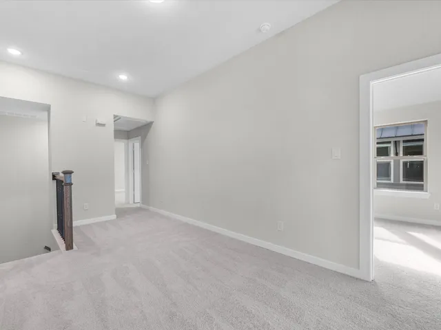 a view of hallway with a large window
