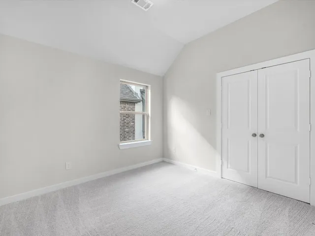 a bathroom with a granite countertop sink a mirror and a bathtub