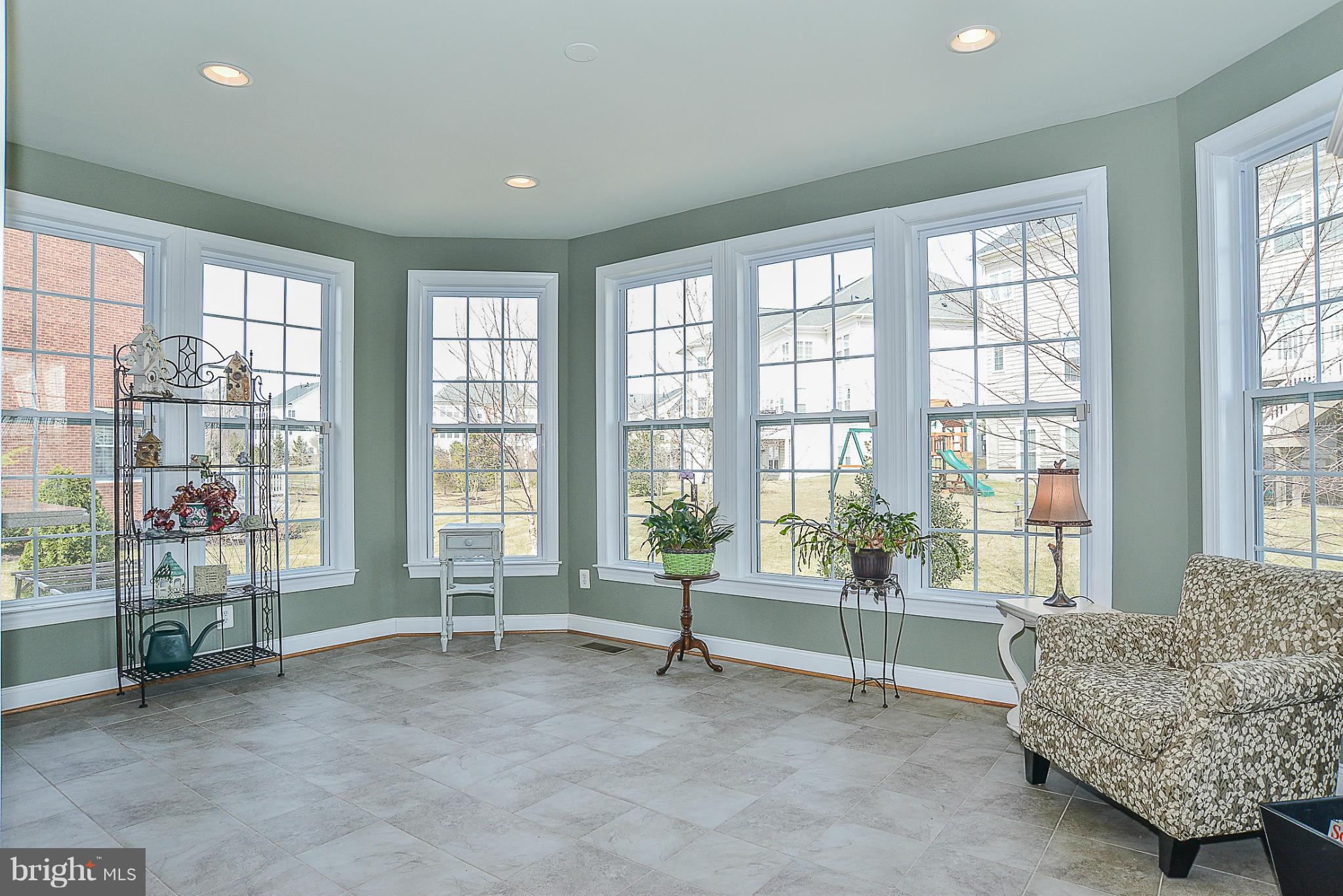 7714 Huntsman Boulevard Springfield, VA 22153 - Photo 11 of 30 Sunroom off kitchen