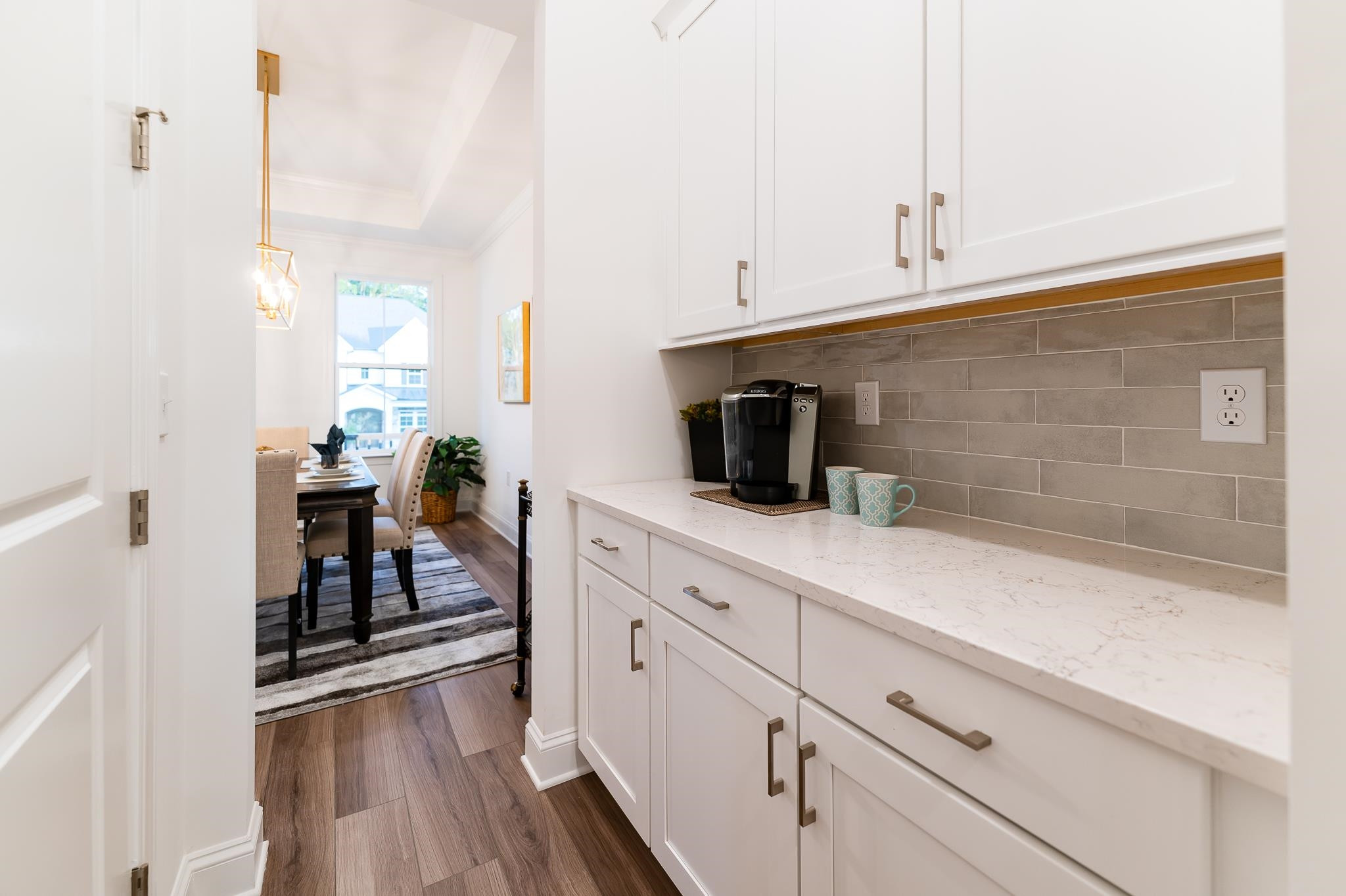 7640 Hasentree Way Wake Forest, NC 27587 - Photo 9 of 40 a kitchen with a sink and cabinets