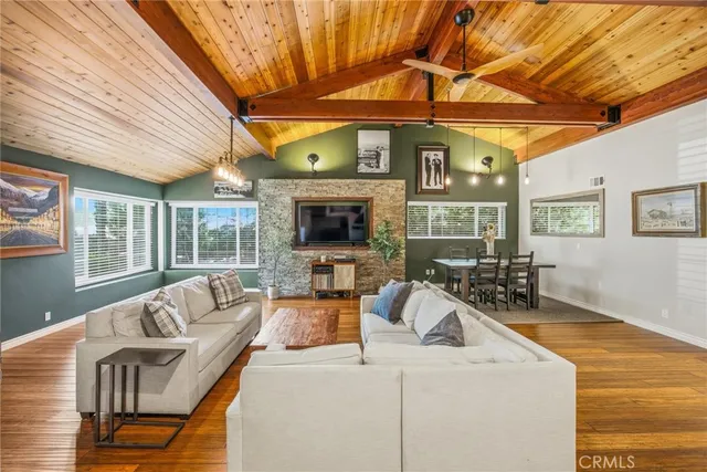 a kitchen with a table chairs refrigerator and cabinets