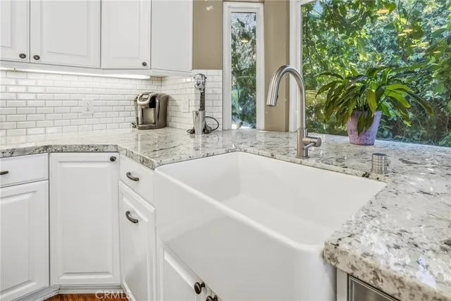 a living room with furniture fireplace and flat screen tv