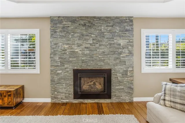 a bedroom with a bed next to a window with the outer view