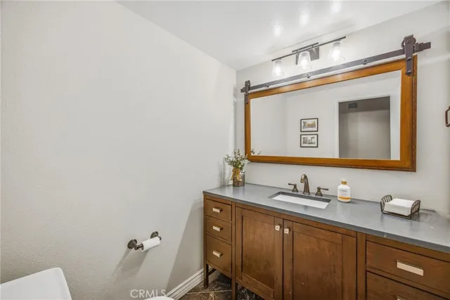 a view of a bedroom with wooden floor and a window