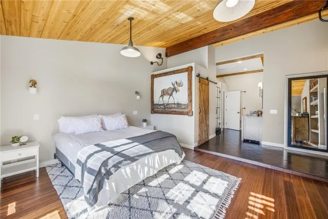 a bedroom with a bed and a chair