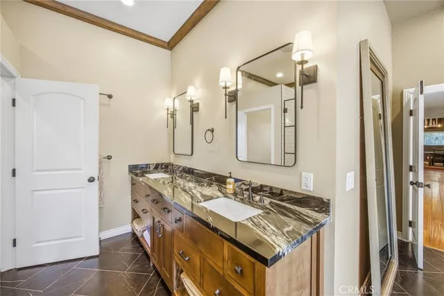 a view of a yard with plants and wooden fence