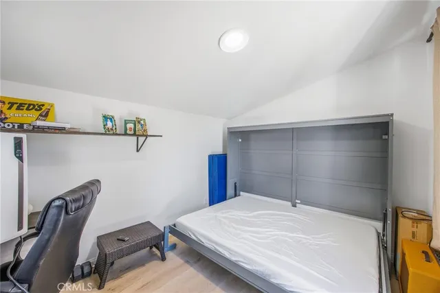 a sign board with buildings in the background