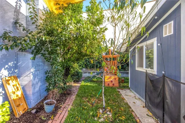 a view of swimming pool with a yard and plants