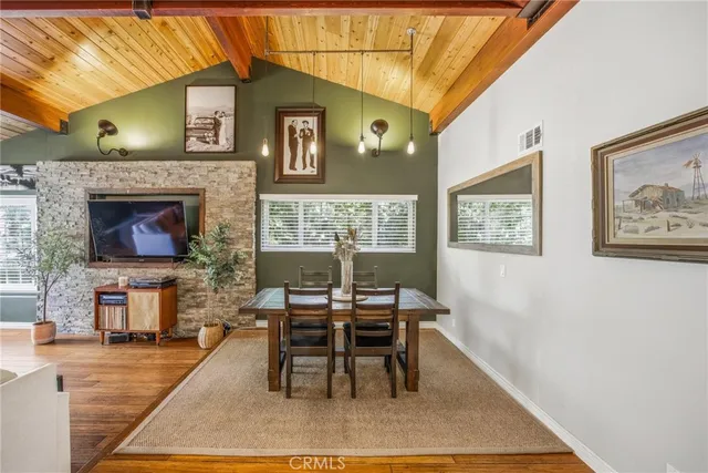 a view of a dining room with furniture and a window