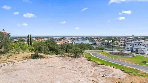 a view of a swimming pool with a yard