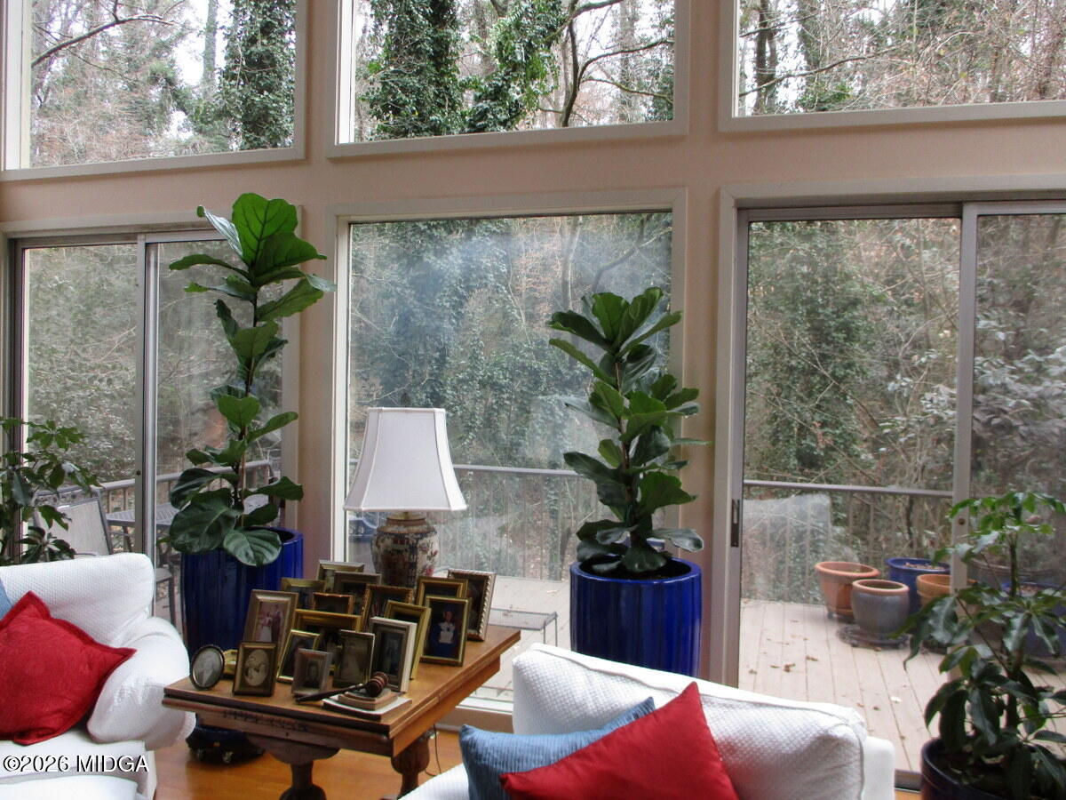 1121 South Jackson Springs Road Macon, GA 31211 - Photo 14 of 29 a living room with furniture and a potted plant