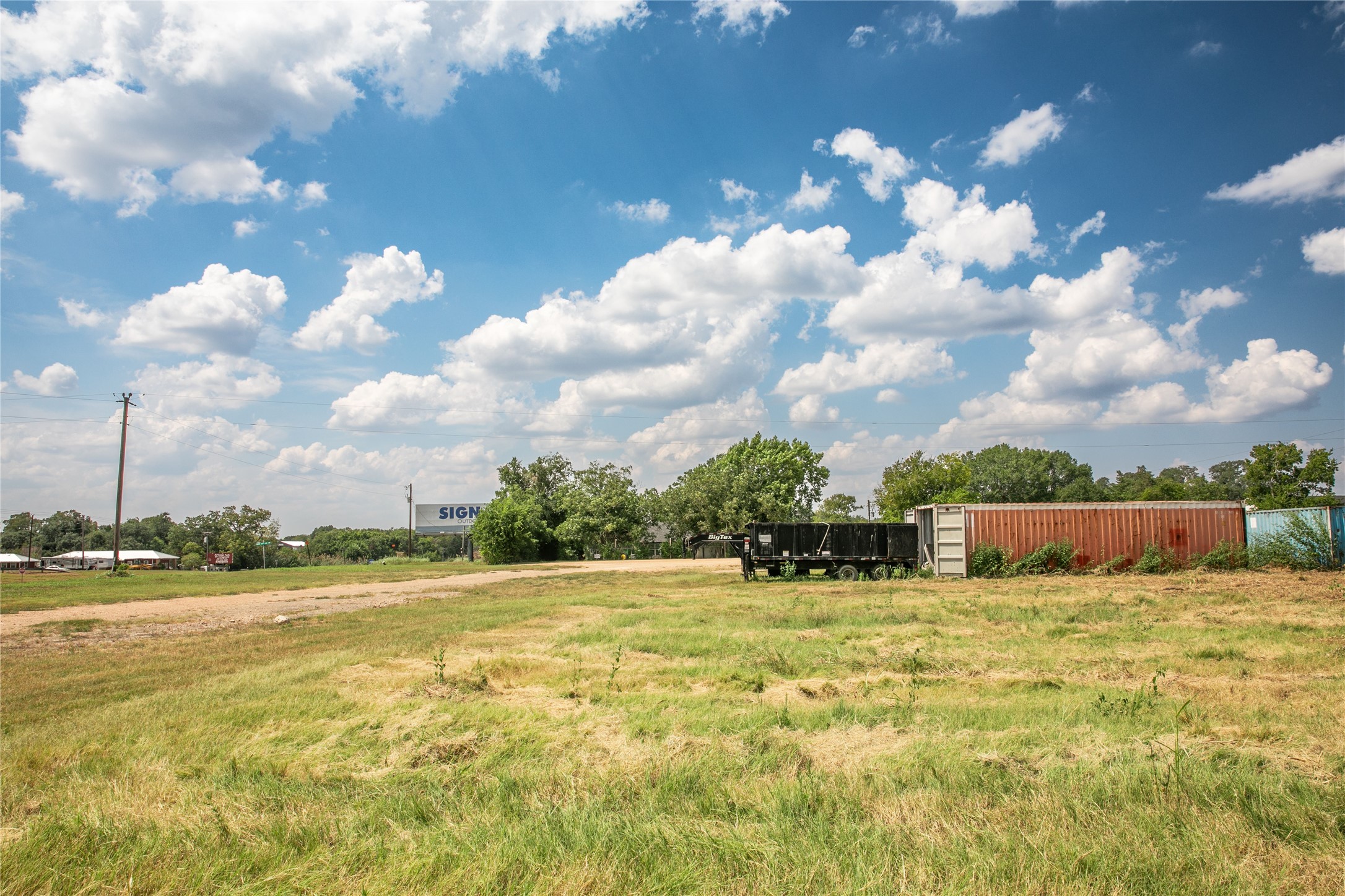 20 Red Tip Lane Brenham, TX 77833 - Photo 19 of 27 a view of pool with lawn chairs and iron fence