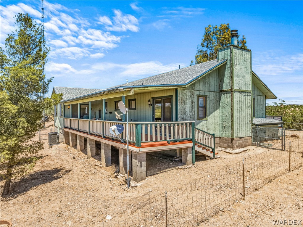 2401 North Stephan Road Kingman, AZ 86401 - Photo 10 of 92 a view of a house with a wooden deck