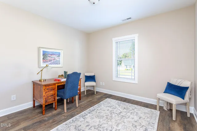 a workspace with furniture and a window