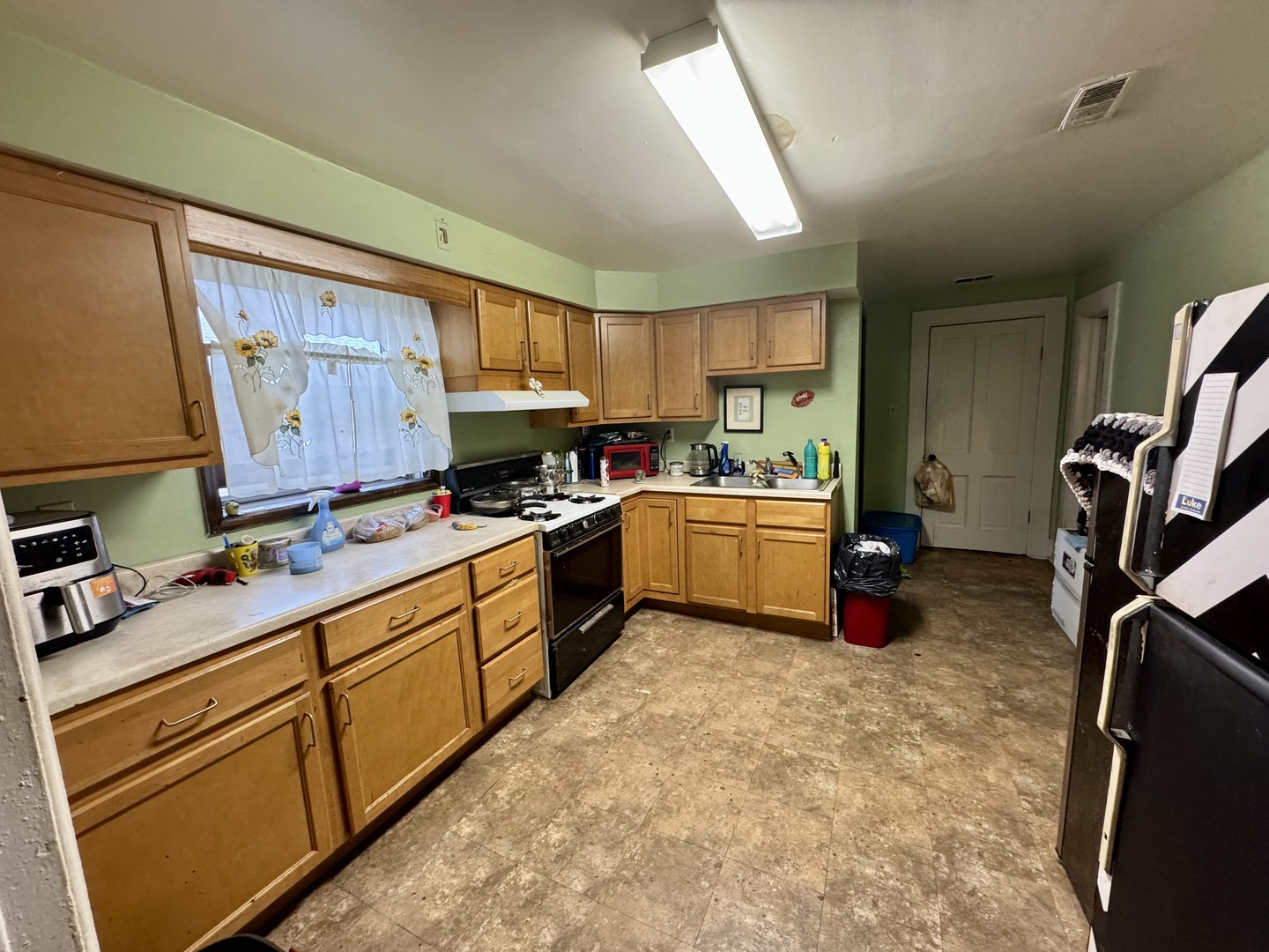 445 State Street Calumet City, IL 60409 - Photo 7 of 15 a kitchen with sink cabinets and window