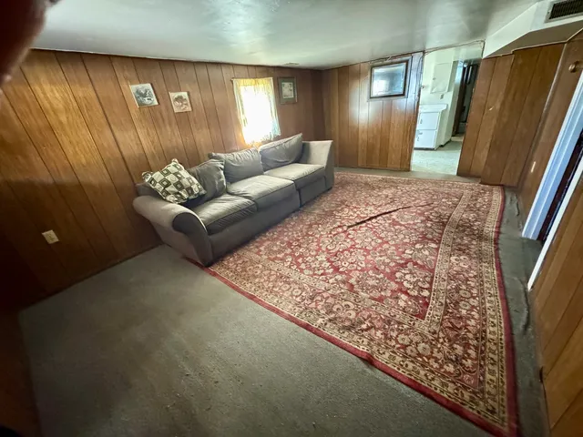 a living room with a couch and a table