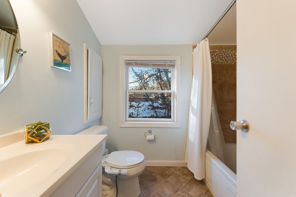 3 Riverside Road Billerica, MA 01821 - Photo 20 of 42 a bathroom with a sink a toilet and shower