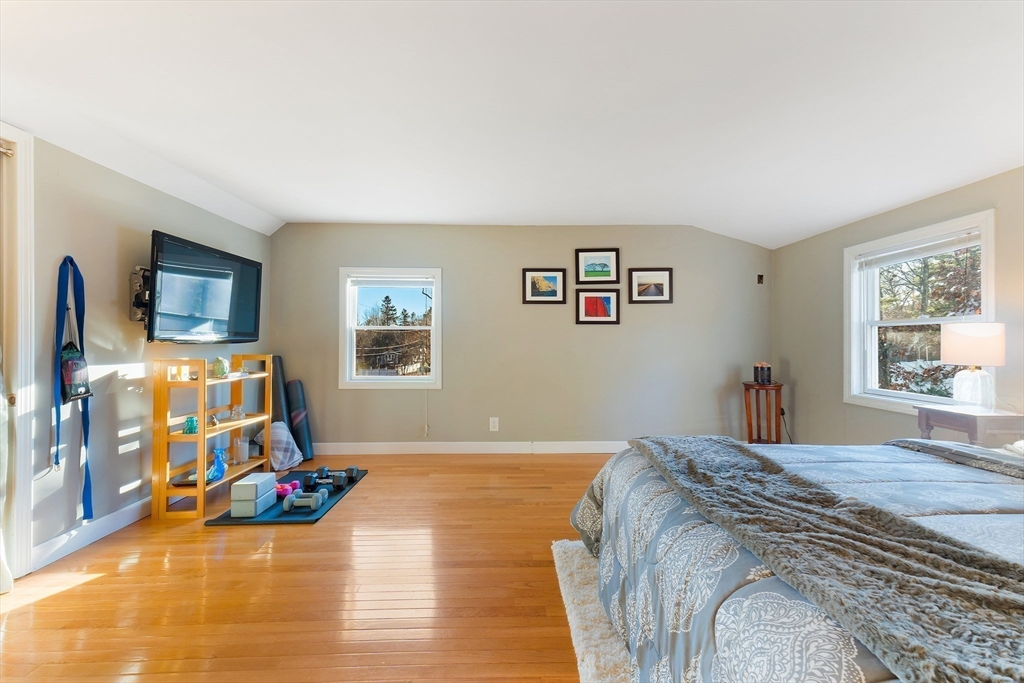 3 Riverside Road Billerica, MA 01821 - Photo 24 of 42 a bedroom with a bed and wooden floor