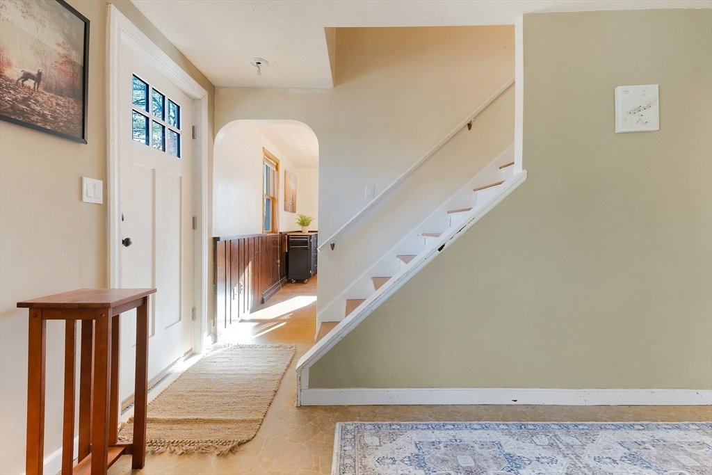 3 Riverside Road Billerica, MA 01821 - Photo 5 of 42 a view of a hallway with entryway wooden floor and front door