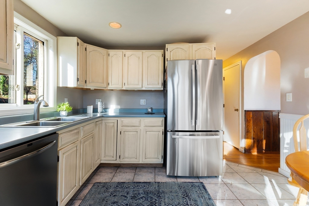 3 Riverside Road Billerica, MA 01821 - Photo 9 of 42 a kitchen with stainless steel appliances granite countertop a refrigerator sink and cabinets
